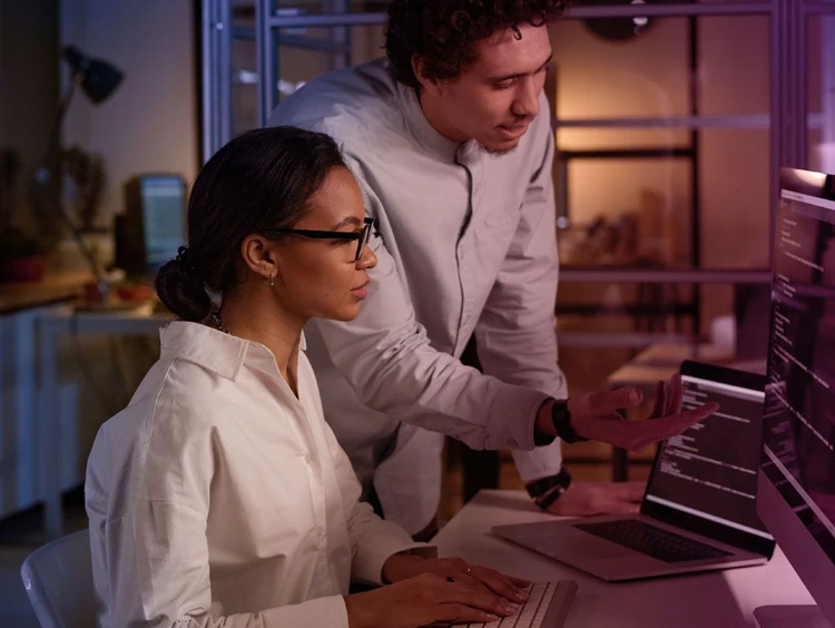 Two colleagues collaborate in the office