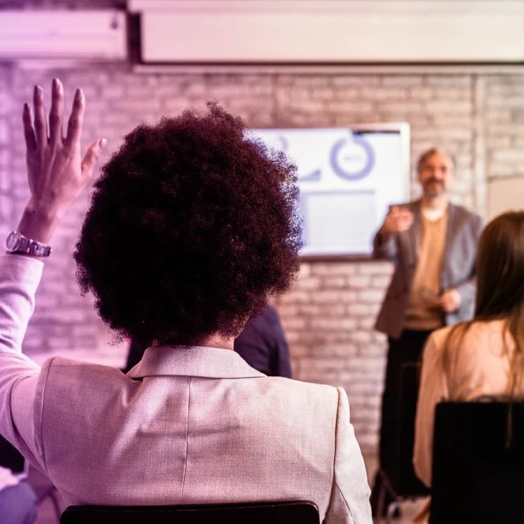 A student actively participating in a workshop session at the Project Management Academy.