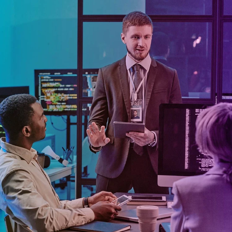 Work team focused on managing risks to achieve continuous improvement.